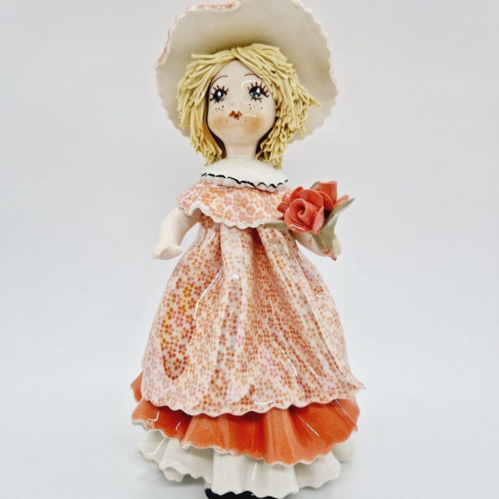 Standing ady with a flower