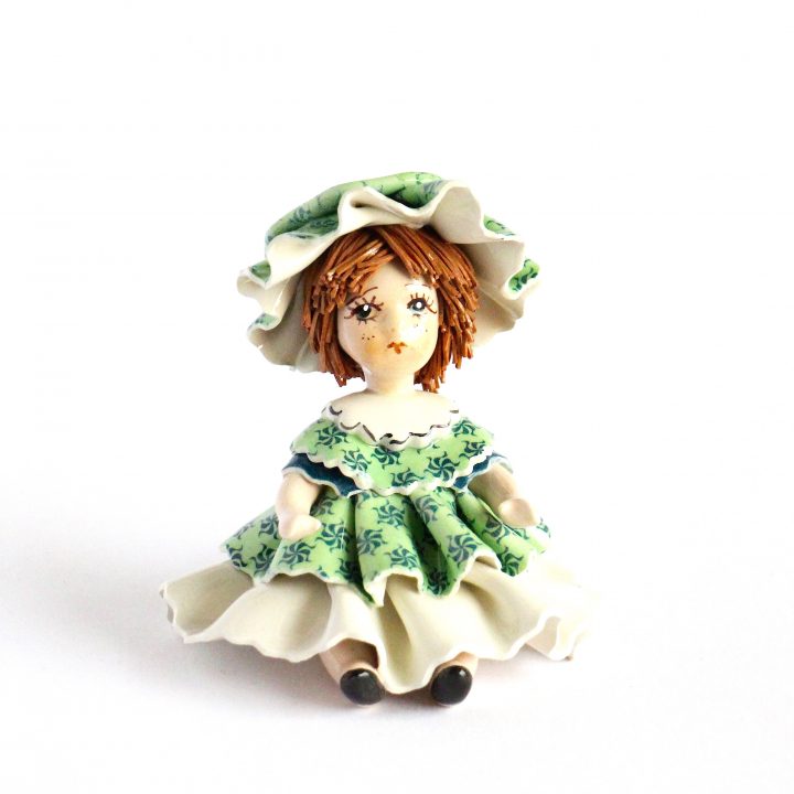 Sitting doll in green