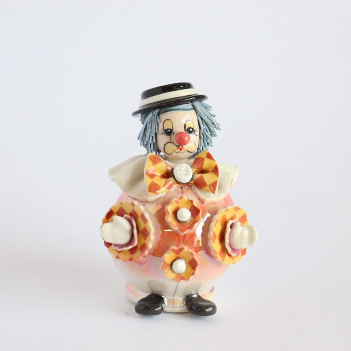 Standing clown with orange bow tie
