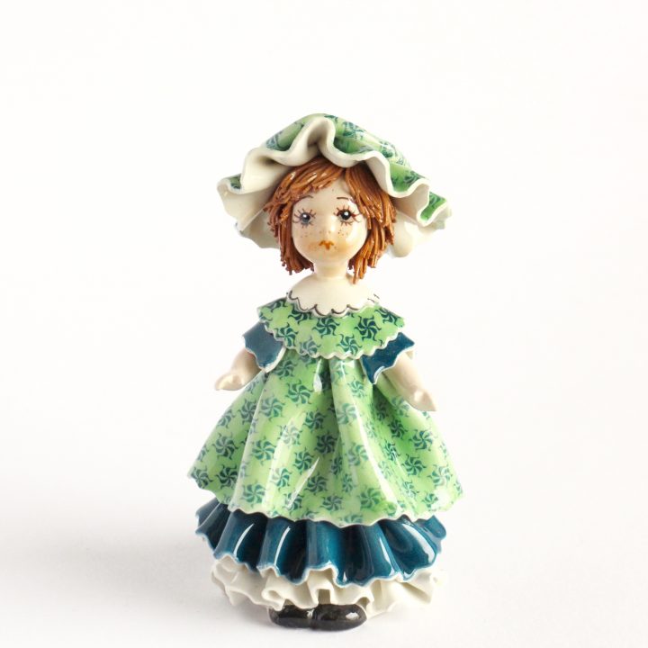 Doll with dark green
