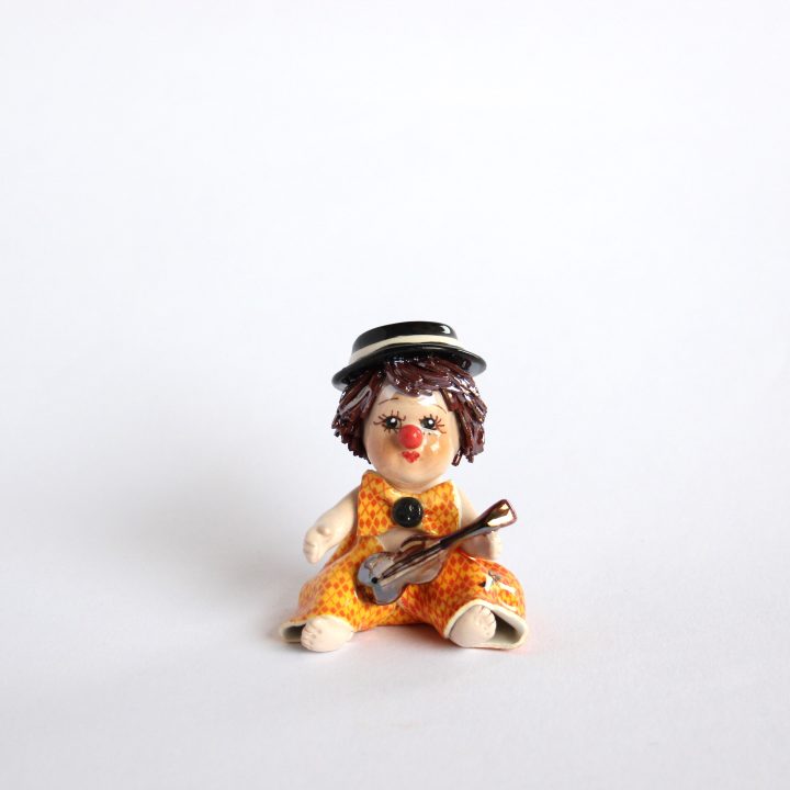 Sitting boy with violine