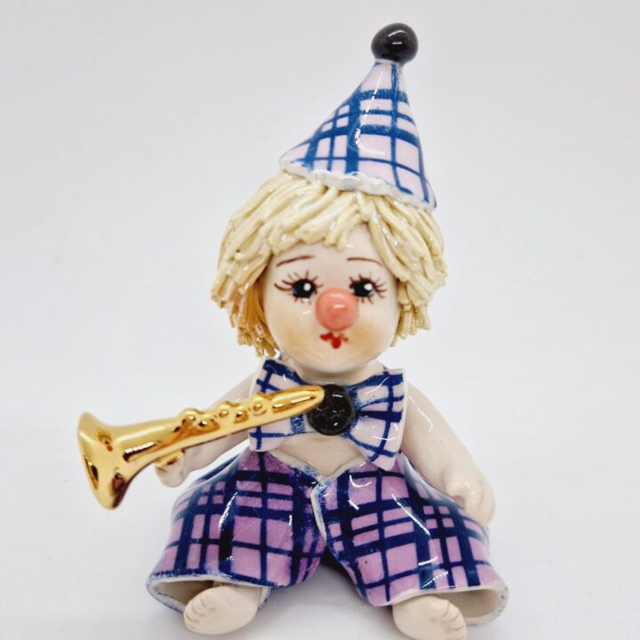 Sitting purple clown