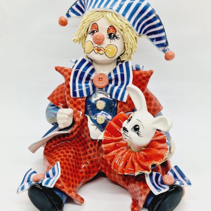 Clown holding rabbit