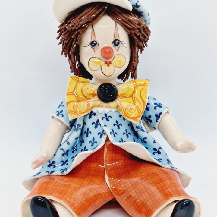 Sitting boy with cap