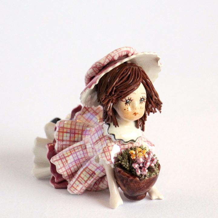 lying doll with flowers